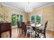 Elegant dining room boasts hardwood floors, large windows, and a stylish chandelier at 4647 16Th Street Ne Pl, Hickory, NC 28601