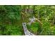 Picturesque lake house featuring a lush, wooded lot, and a private staircase leading to the lake at 4647 16Th Street Ne Pl, Hickory, NC 28601