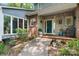 Charming front porch with brick accents, inviting entryway and neatly landscaped garden at 4647 16Th Street Ne Pl, Hickory, NC 28601