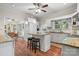 Bright kitchen featuring granite counters, stainless steel appliances, a center island, and beautiful wood-look flooring at 4647 16Th Street Ne Pl, Hickory, NC 28601