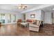 Spacious living room with a ceiling fan and access to the backyard at 4647 16Th Street Ne Pl, Hickory, NC 28601