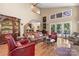 Elegant living room with hardwood floors, tall ceilings, and an abundance of natural light with views of the outside at 4647 16Th Street Ne Pl, Hickory, NC 28601