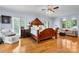 Spacious main bedroom featuring hardwood floors, large windows, and a sitting area at 4647 16Th Street Ne Pl, Hickory, NC 28601