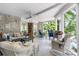 Inviting screened-in porch with ceiling fan, brick accents, comfortable seating and views of the yard at 4647 16Th Street Ne Pl, Hickory, NC 28601