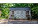 Utility shed with metal roof, double doors, and window boxes at 4647 16Th Street Ne Pl, Hickory, NC 28601