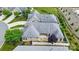 Bird's-eye view of a well-kept home with a backyard patio, landscaping, and a gray shingle roof at 5028 Polo Gate Blvd, Charlotte, NC 28216