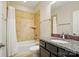Bathroom features a shower and bathtub combo with a granite countertop vanity at 5028 Polo Gate Blvd, Charlotte, NC 28216