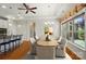Elegant dining room with modern light fixture, breakfast bar, and picture window at 5028 Polo Gate Blvd, Charlotte, NC 28216