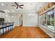 Dining space with hardwood floors, a view of the exterior, and a chandelier for ample lighting at 5028 Polo Gate Blvd, Charlotte, NC 28216