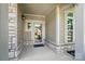 Covered front porch with stone accents and a view of the landscaped front yard at 5028 Polo Gate Blvd, Charlotte, NC 28216