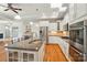 Modern kitchen featuring granite countertops, stainless steel appliances, and an island with seating at 5028 Polo Gate Blvd, Charlotte, NC 28216