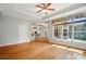 Bright living space with hardwood floors, connecting to a modern kitchen and dining area at 5028 Polo Gate Blvd, Charlotte, NC 28216