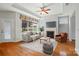 Bright living room features hardwood floors, fireplace, ceiling fan, and plenty of natural light at 5028 Polo Gate Blvd, Charlotte, NC 28216