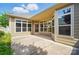 A neutral colored home featuring a concrete patio, windows, and plenty of natural light at 5028 Polo Gate Blvd, Charlotte, NC 28216