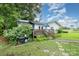 Cozy backyard view showcasing a wooden deck, BBQ grill, a well-maintained yard and exterior white siding at 5240 Old Monroe Rd, Indian Trail, NC 28079