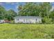 Quaint single-story home featuring a well-maintained exterior and a generous front lawn at 5240 Old Monroe Rd, Indian Trail, NC 28079