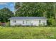 Cozy single-story home with a simple design and surrounded by lush greenery, offering a peaceful retreat at 5240 Old Monroe Rd, Indian Trail, NC 28079