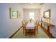 Elegant dining room with natural light, stylish decor, and a classic wooden dining table at 545 Stroupe Rd, Gastonia, NC 28056