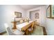 Elegant dining room with a neutral color palette, stylish decor, and a classic wooden dining table at 545 Stroupe Rd, Gastonia, NC 28056