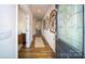 Inviting entryway featuring hardwood floors, decorative wall art, and a stained-glass front door at 545 Stroupe Rd, Gastonia, NC 28056