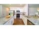 Bright kitchen with stainless appliances and a granite counter flows seamlessly from kitchen to dining at 545 Stroupe Rd, Gastonia, NC 28056