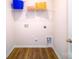 An empty laundry room with shelving and laminate wood flooring at 545 Stroupe Rd, Gastonia, NC 28056