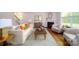 Bright living room with wood floors features a fireplace and seating area, perfect for relaxing at 545 Stroupe Rd, Gastonia, NC 28056
