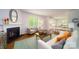 Comfortable living room features a fireplace, plenty of sunlight, and is open to the kitchen at 545 Stroupe Rd, Gastonia, NC 28056