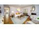Open living room with lots of seating features a fireplace and opens to the foyer and stairs at 545 Stroupe Rd, Gastonia, NC 28056