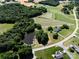 Breathtaking aerial shot of the property with dual ponds, trees, and surrounding landscape at 5710 Lander Benton Rd, Unionville, NC 28110