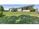 Well-maintained backyard with lush green grass and a view of the home's covered porch and deck at 5710 Lander Benton Rd, Unionville, NC 28110