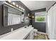 Bathroom featuring dark painted walls, shelves, white subway tiles and modern fixtures at 5710 Lander Benton Rd, Unionville, NC 28110
