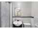 Bathroom featuring black and white tiled wall, shower, toilet and single sink at 5710 Lander Benton Rd, Unionville, NC 28110
