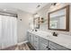 Bathroom with double sink vanity, stylish mirrors and modern fixtures at 5710 Lander Benton Rd, Unionville, NC 28110
