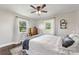 Bedroom featuring hardwood floors, large windows, vintage decor, and comfortable bedding at 5710 Lander Benton Rd, Unionville, NC 28110