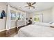 Bedroom featuring two beds, windows, ceiling fan, hardwood floors and a writing desk at 5710 Lander Benton Rd, Unionville, NC 28110