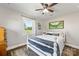 Cozy bedroom featuring a white wood bed, decorative pillows, natural light and hardwood floors at 5710 Lander Benton Rd, Unionville, NC 28110