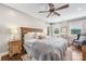 Comfortable bedroom with hardwood floors, neutral paint and a wooden frame bed at 5710 Lander Benton Rd, Unionville, NC 28110