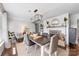Dining room featuring an open fireplace, overhead lighting, and view into the living area at 5710 Lander Benton Rd, Unionville, NC 28110