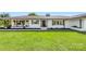 Charming white brick home with a black front door and large green front lawn at 5710 Lander Benton Rd, Unionville, NC 28110