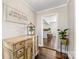 Inviting hallway with hardwood floors and vintage-style decor at 5710 Lander Benton Rd, Unionville, NC 28110