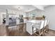 Bright, updated kitchen with white cabinets, stainless steel appliances, and breakfast bar at 5710 Lander Benton Rd, Unionville, NC 28110