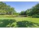 Picturesque pond surrounded by lush greenery and mature trees at 5710 Lander Benton Rd, Unionville, NC 28110