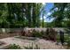 Lovely backyard featuring a garden with raised beds and beautiful rose bushes at 5777 Stephanie St, Charlotte, NC 28212