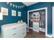 Bedroom room featuring a changing table with drawers, and a uniquely decorated closet at 5777 Stephanie St, Charlotte, NC 28212