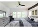 Well-lit bedroom with large windows, neutral colors, and modern furniture at 5777 Stephanie St, Charlotte, NC 28212