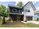 Attractive two-story home features modern siding, solar panels, and well-maintained landscaping at 5777 Stephanie St, Charlotte, NC 28212