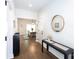 Bright foyer features hardwood floors, modern decor, and a glimpse of the adjacent dining area at 5777 Stephanie St, Charlotte, NC 28212