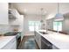 Well-lit kitchen features stainless steel appliances, white cabinetry, and an open design at 5777 Stephanie St, Charlotte, NC 28212