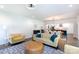 Open living room features a fireplace, plush seating, and views into the dining and kitchen areas at 5777 Stephanie St, Charlotte, NC 28212